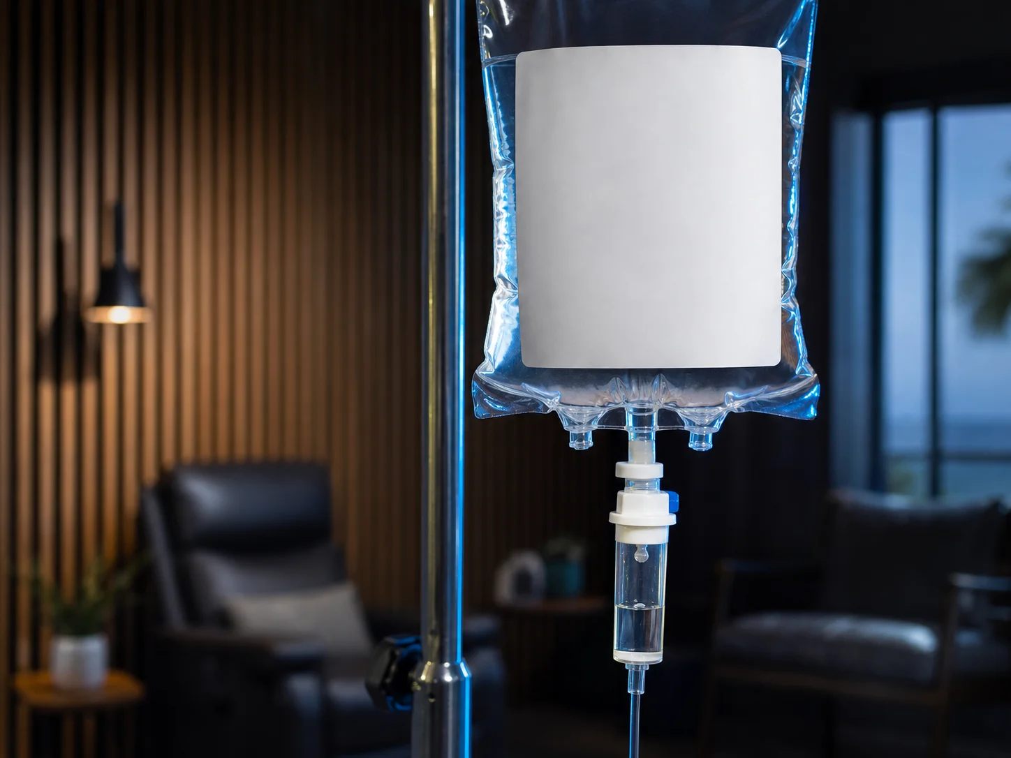 Migraine Relief IV bag hanging in a dimmed treatment room at InnerWorks