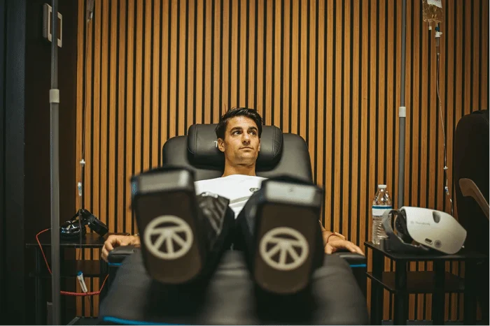 Patient relaxing with IV therapy at a health consultation